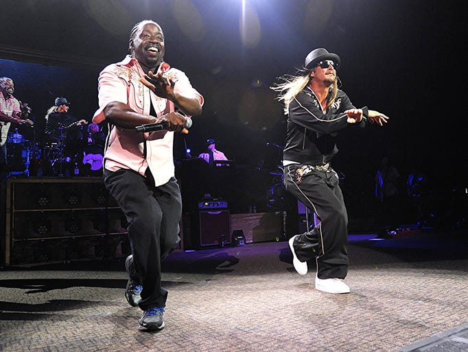 Kid Rock and backup singer Herschel Boone perform a