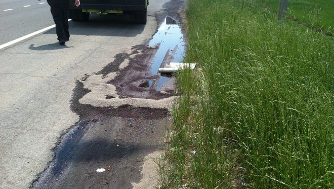 A Metro Water Services crew helped dispose of hundreds of gallons of wine Tuesday after after it spilt out of truck on Interstate 40.