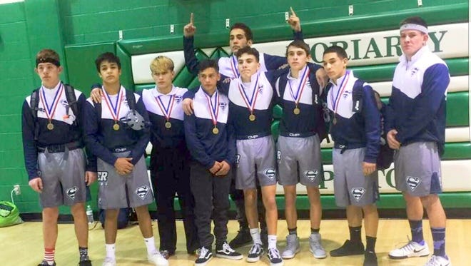 From left, are Jayden Weitholter, Michael Aguirre III, Lonnie Sandoval, Vince Marin, Vinnie Vega, Zeke Marquez, Ricky Villalobos, Ramon Montoya and Armando Galindo. The Silver High wrestlers won individual district titles in Moriarity this past weekend.