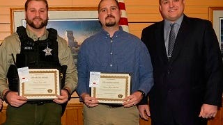 Receiving Life Saving awards, from left: Dodge County Sheriff’s Deputy Taylor Nehls and Deputy Michael Matoushek. Deputy Jaime Buelter was not present. Sheriff Dale Schmidt is at right.