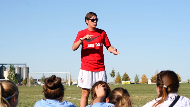 Abby Wambach works with kids at the elite soccer clinic.