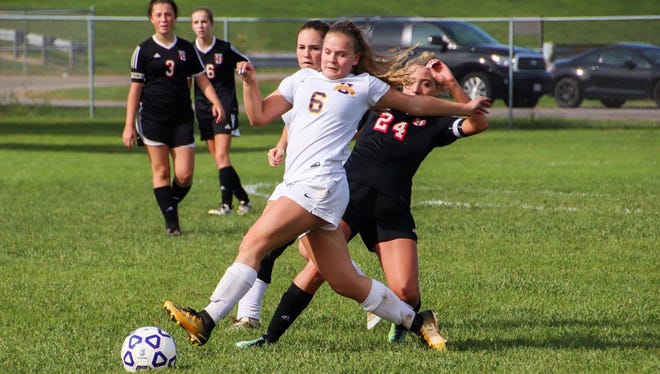 Unioto's Maiju Lintulahti battles with a Circleville defender during the first half of Saturday's Division II sectional final at Unioto High School. The Shermans handed the Tigers a season-ending 4-1 loss.