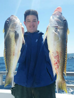 Shawn Leonard with a pair of golden tilefish he caught on the Gambler