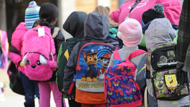 Kindergarteners line up before school at the Green Bay Area Public School District's Early Learning Center.