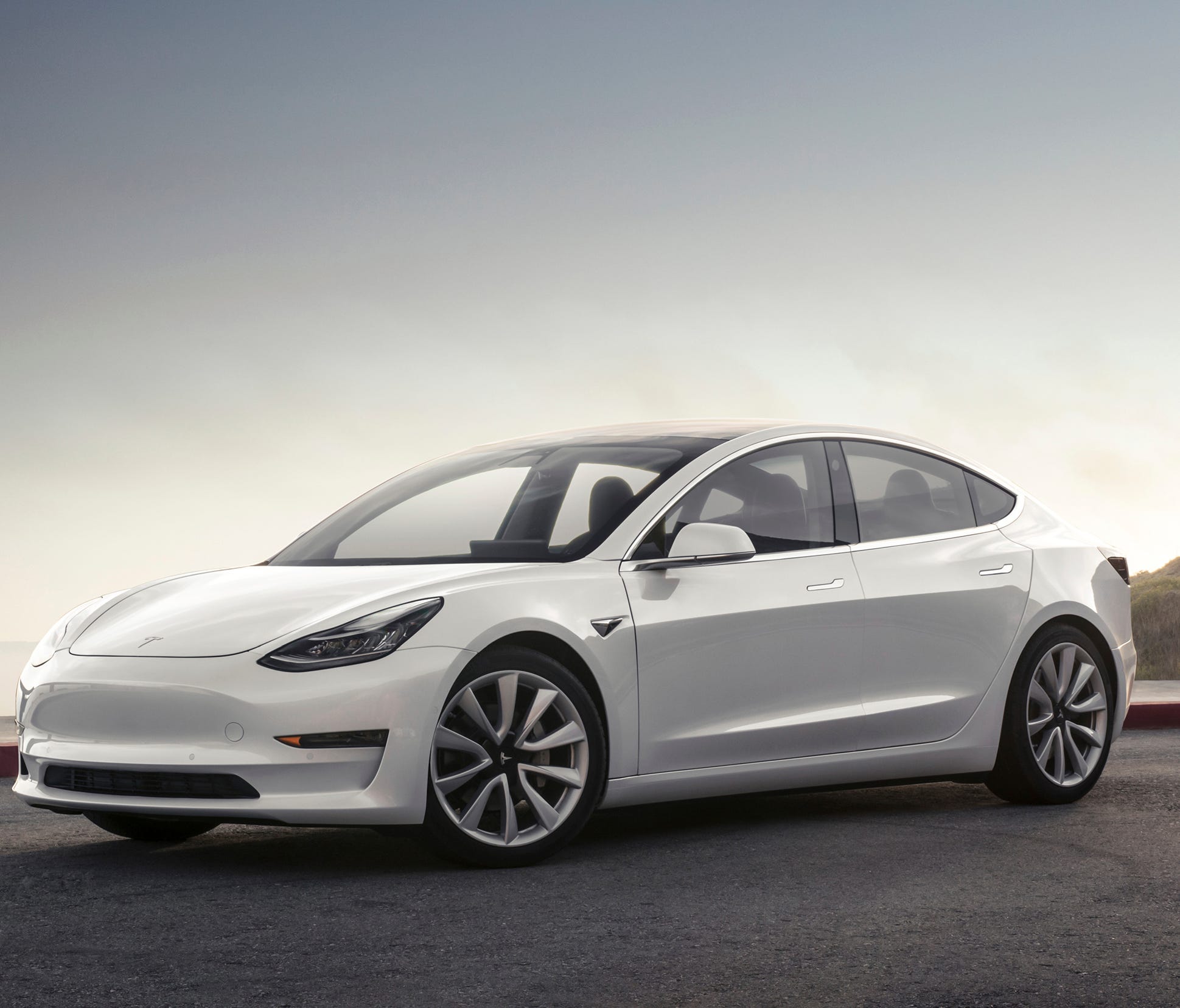 This photo provided by Tesla shows the 2017 Tesla Model 3, a compact electric sedan that offers two levels of range. It's the newest model from Tesla and slots below the Model S sedan in the company's lineup.