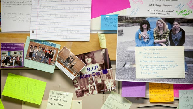 Dozens of notes and photographs are left at Winchester High School student Allie McKim's locker on Monday by friends and classmates after death on Saturday following a car accident. McKim was known as a quiet but compassionate student by teachers and friends. 