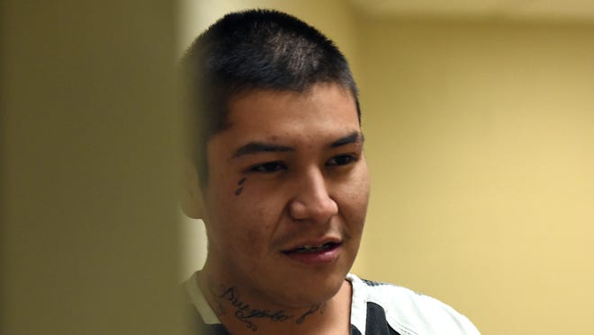 Sheldon Cortez is escorted into Minnehaha County Court in Sioux Falls, S.D., Wednesday, March 30, 2015.