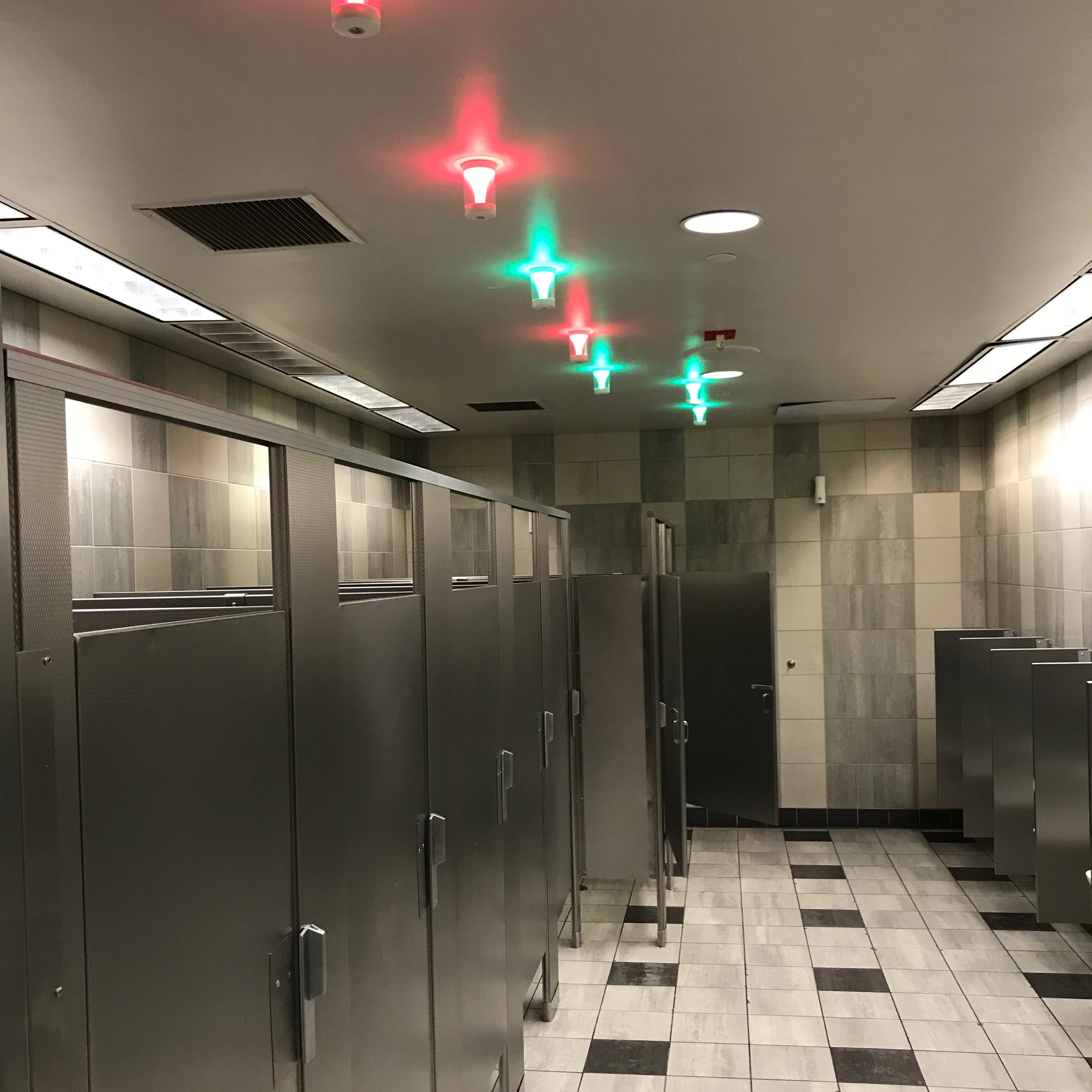 LAX will showcase technology that uses overhead lights to signal if a bathroom stall is occupied or not.