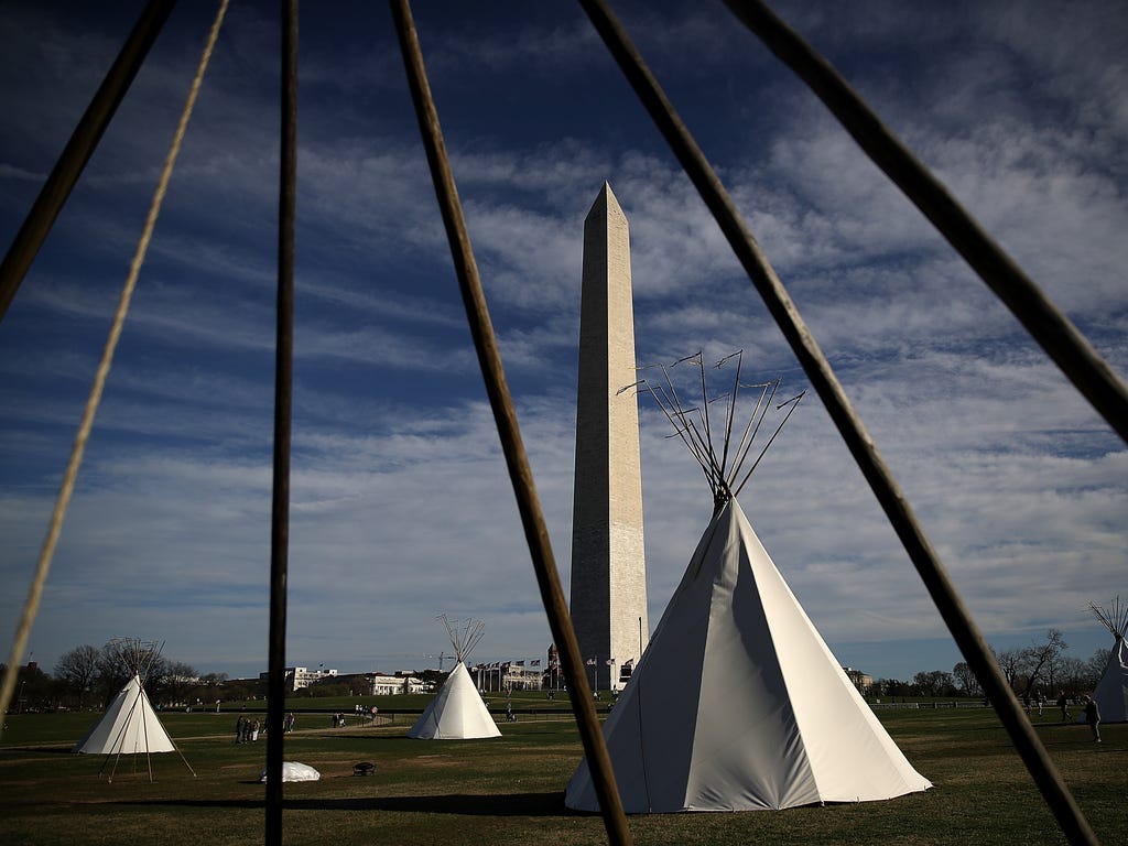 Tepees set up by Dakota Access Pipeline protesters stand next to the Washington Monument. Indigenous-rights activists set up the camp ahead of a protest planned for March 10 at the Army Corps of Engineers headquarters and outside the White House.
