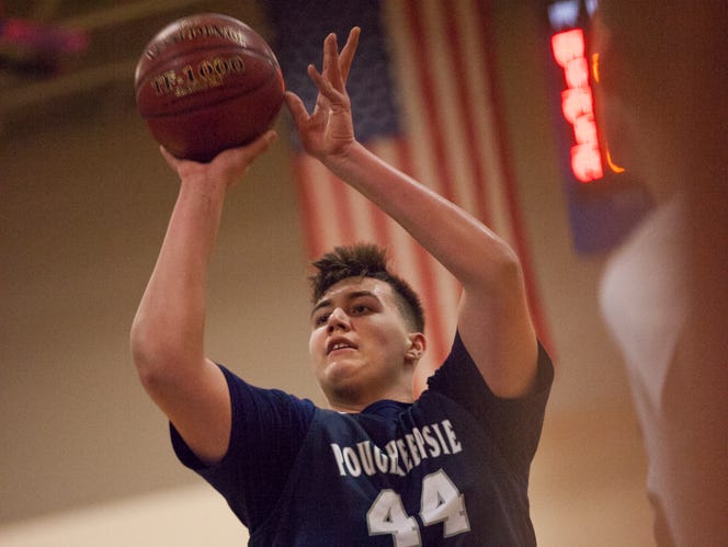 Corey Simmons takes a free throw shot against Goshen in Poughkeepsie's 100-92 winning game, securing the Section 9 Class A basketball championship title at Mount Saint Mary College in Newburgh, March 5, 2017
