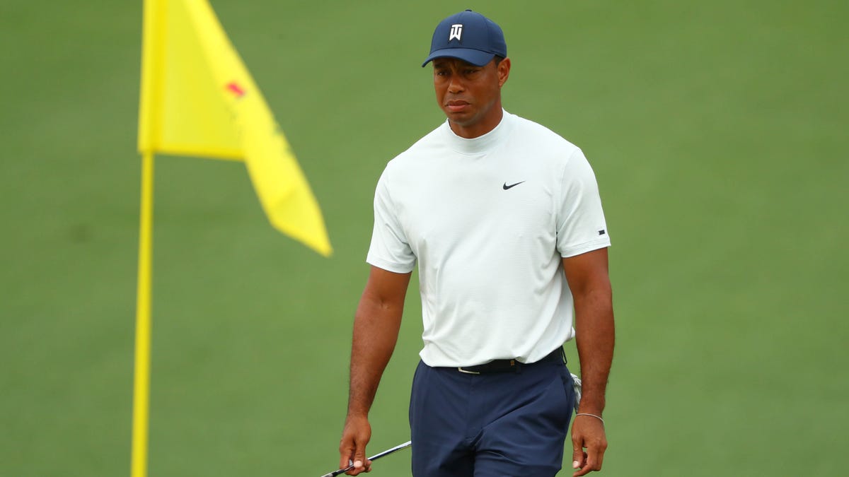 Tiger Woods was nearly tripped when a security guard slipped into his leg on the 14th hole. He birdied the hole on the way to a 4-under 67.