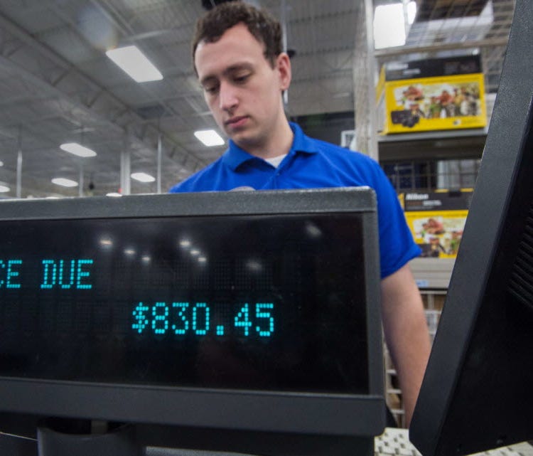 Salesperson at Best Buy store, Fairfax, Va., Nov. 27, 2014.