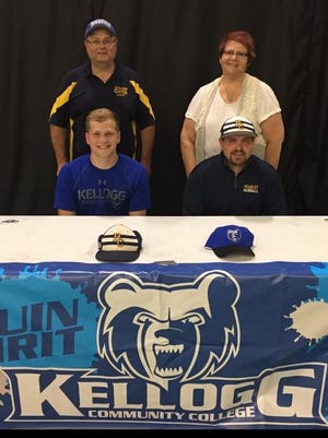 Battle Creek Central graduate Riley Cramer (bottom left) signs a National Letter of Intent to play baseball at Kellogg Community College. He is seated next to Battle Creek Central baseball coach Casey Bess. Standing are his parents, Tom and Jan Cramer.