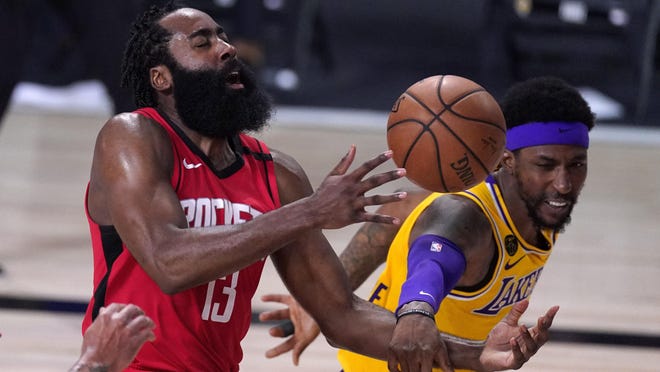 Houston Rockets' James Harden (13) is fouled by Los Angeles Lakers' Kentavious Caldwell-Pope on Thursday in Lake Buena Vista, Fla.
