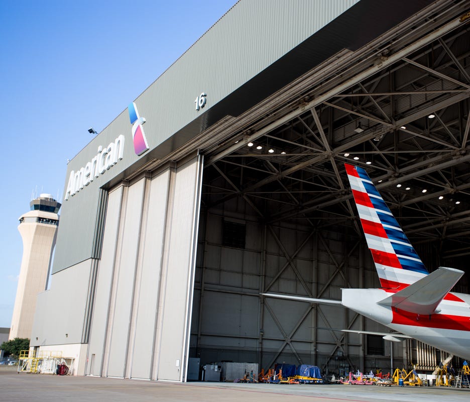 The tail of an American Airlines Boeing 777 peeks out of a hangar at Dallas/Fort Worth International Airport on Oct. 14, 2016.