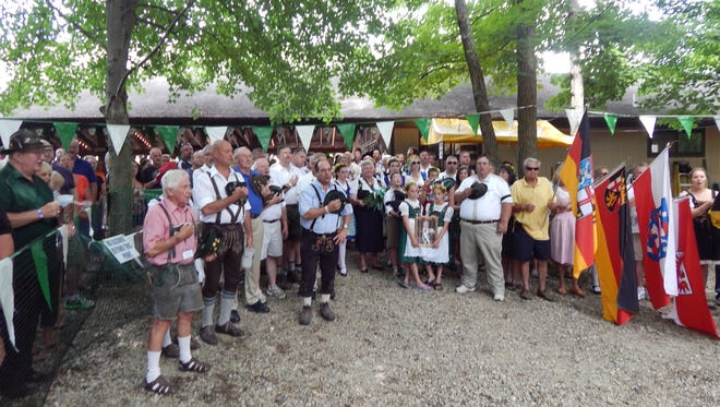 Singing the National Anthem before the beginning of shooting at 2014 Schützenfest.