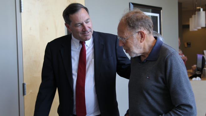 Indiana U.S. Sen. Joe Donnelly, left, talks with Michael Rossmann, a Purdue University researcher who helped lead the discovery of the Zika virus. Donnelly and NIH Director Francis Collins came to the university Thursday to discuss federal funding and Zika.
