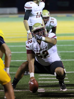 Midwestern State center Akoakoa Paleka-Kennedy makes the call for the offensive line in their game against Texas A&M-Commerce. Kennedy was named the Rimington Award winner Wednesday as the top center in NCAA Division II football.