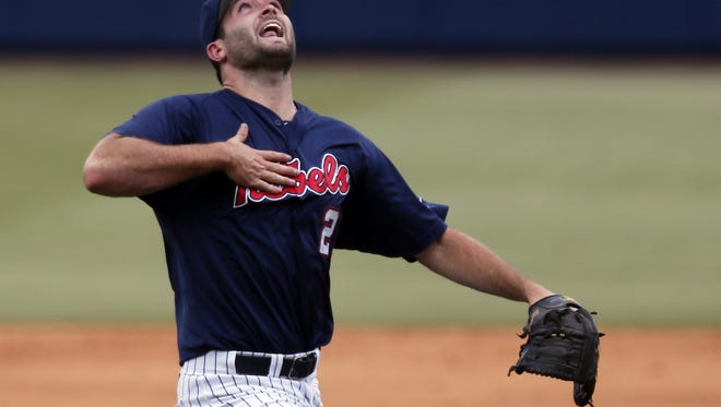 Mississippi pitcher Sam Smith (29) calls for a second inning Washington pop fly in the second inning of an NCAA college baseball regional tournament championship game in Oxford, Miss., Monday, June 2, 2014. (AP Photo/Rogelio V. Solis)