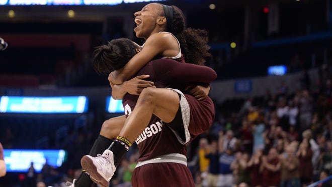 Mississippi State forward Breanna Richardson, left, hugs teammate Morgan William, right, after defeating Baylor in the Oklahoma City Region finals of the women's NCAA tournament at Chesapeake Energy Arena.
