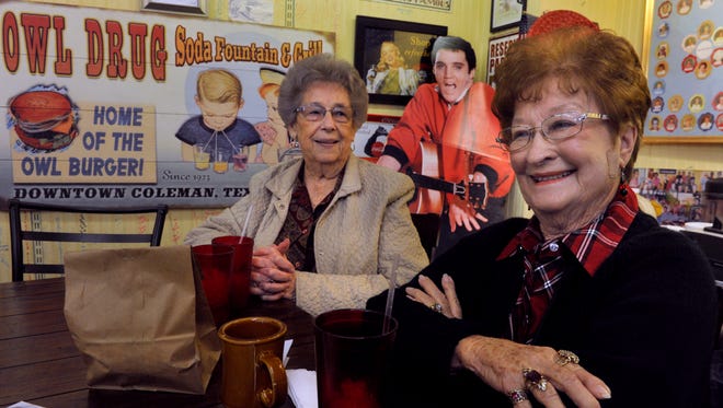 Peggy Burdick (left) and Maxine Cope drink coffee and socialize with friends at Owl Drug store in Coleman Friday. The ladies are part of the Fun Bunch, an informal group that has met at the store five-times-a-week for over 50 years.