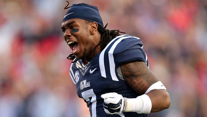 Trae Elston, no. 7 of the Ole Miss Rebels celebrates against the Alabama Crimson Tide on October 4, 2014 at Vaught-Hemingway Stadium in Oxford, Mississippi.