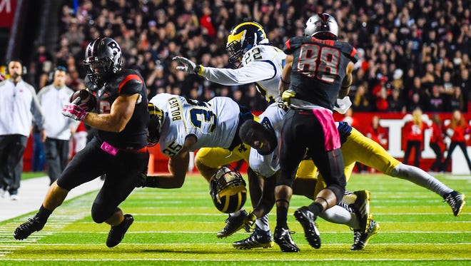 Jourdan Lewis, now a senior cornerback for Michigan, loses his helmet on this play in the 2014 game at Rutgers.