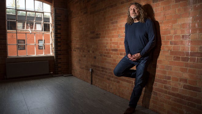 FILE - In this Tuesday, Sept. 9, 2014 file photo, British musician Robert Plant poses for photographs ahead of an interview with the Associated Press at Camden Lock in north London, England. following the launch of his ninth solo studio album "lullaby andâ?¦The Ceaseless Roar," and a show at Londonâ??s Roundhouse as part of iTunes Festival on Monday. He's as snug as a hobbit in his hole in his native country after returning to record his latest album, and he doesn't plan on changing his home base soon.