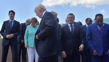 President Trump walks past Canadian Prime...