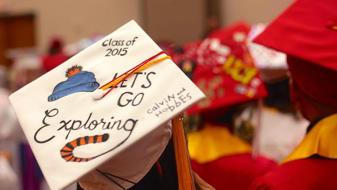Palm Springs High School students wear decorated graduation caps at their graduation ceremony at the Palm Springs Convention Center on June 2, 2015.