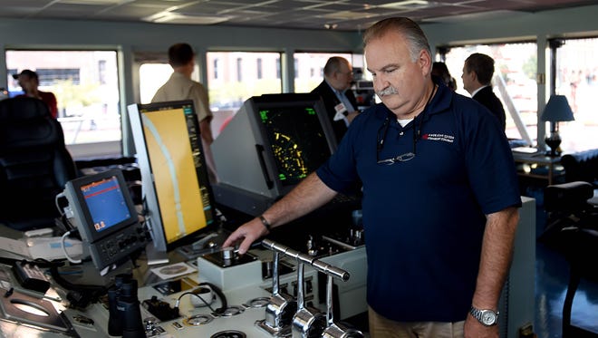 The Motor Vessel Mississippi towboat pilot John Sutton checks the controls before departing Nashville after the U.S. Army Corps of Engineers gave tours to employees and the media on Wednesday.