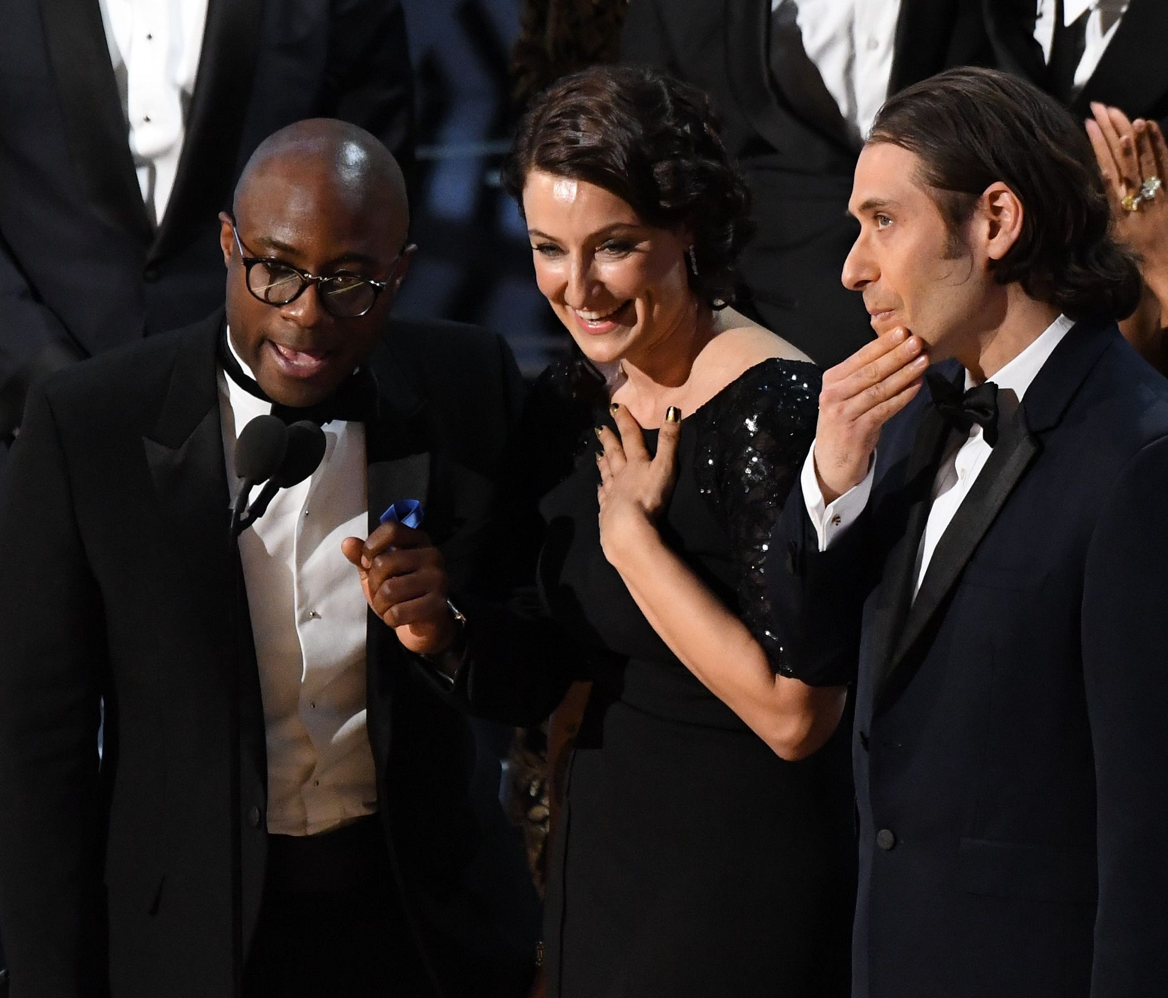 After a two-minute 'La La Land' win for best picture was a mistake, director Barry Jenkins (left) accepts the award for 'Moonlight.'