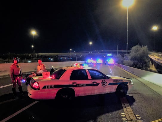 DPS troopers at the scene of a wrong-way driver crash