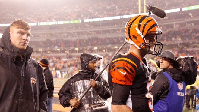 Bengals quarterbacks Andy Dalton (left) and AJ McCarron leave the field after losing to the Steelers, 18-16, at Paul Brown Stadium on Saturday.