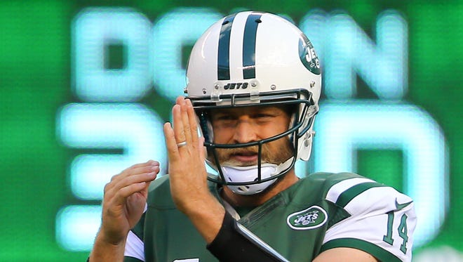 New York Jets quarterback Ryan Fitzpatrick (14) calls a timeout during the second half at MetLife Stadium.