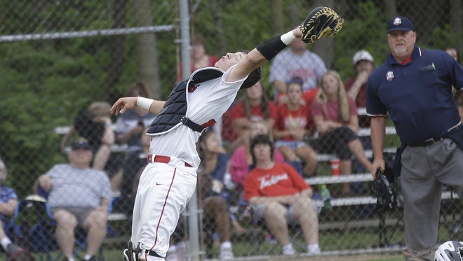 Fairfield catcher Brock Mathis catches a foul ball during the Indians' baseball game against Lakota West, Monday, May 4.