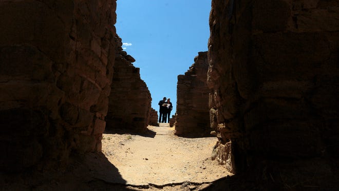 Peter, left, and Risa Barajas, of Phoenix, look over a tour book Tuesday at Aztec Ruins National Monument, part of the extensive nontaxable federal land holdings in San Juan County.