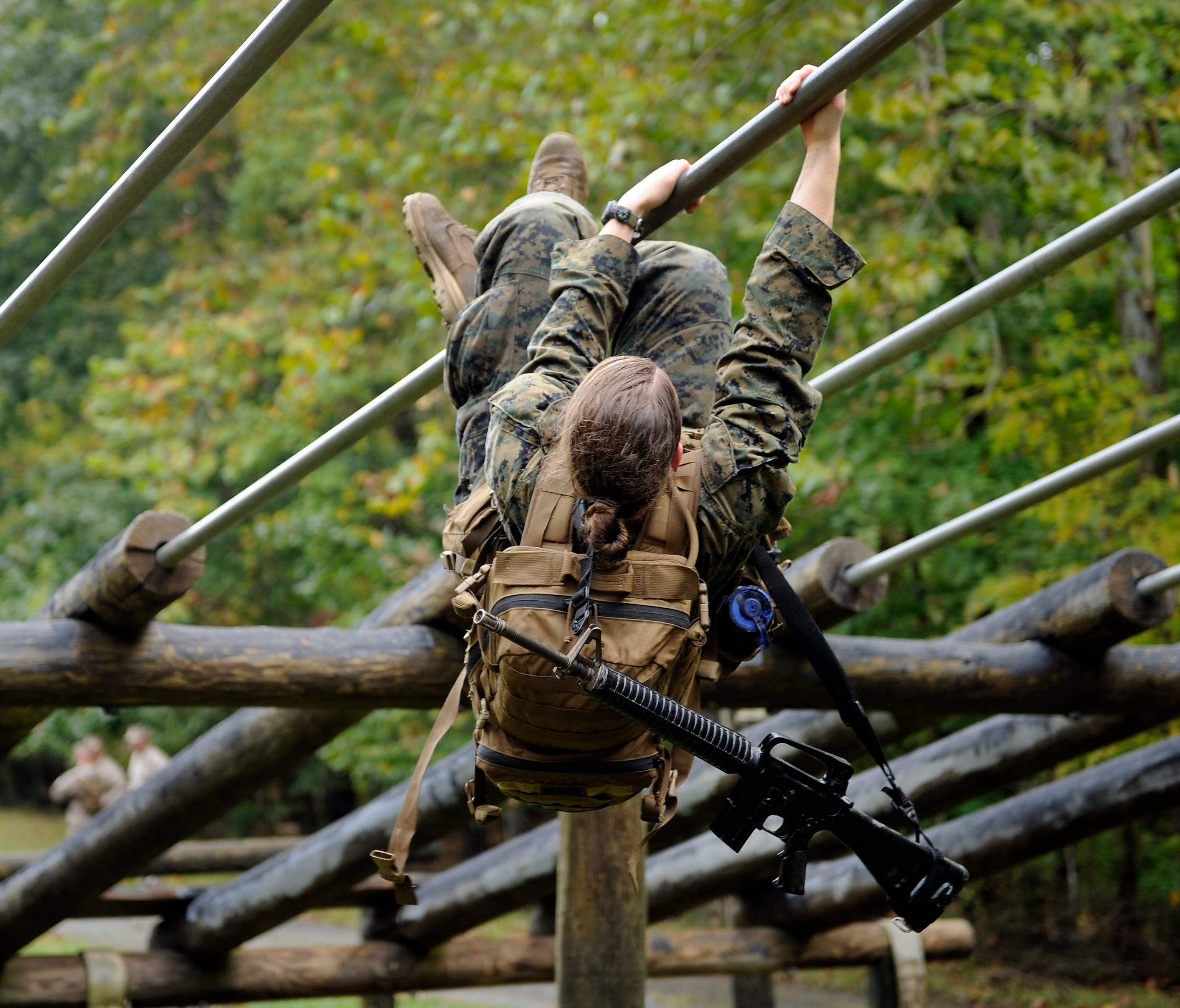 9/28/12 11:06:15 AM --  Quantico, VA, U.S.A -- Female Marines taking combat endurance test, the first event in the Infantry Officers Course. --  A woman Marine goes through an obstacle course, one of the tasks of the combat endurance test.   Photo by