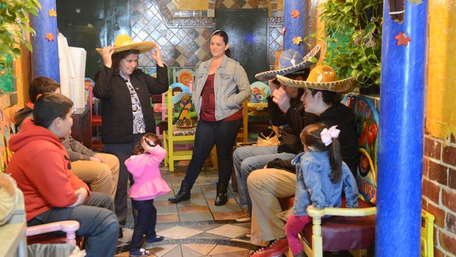 
Members of the Jimenez family, who own Casa Fiesta in Fremont, joke with one another. The family is part of Fremont’s rapidly growing Hispanic population.
