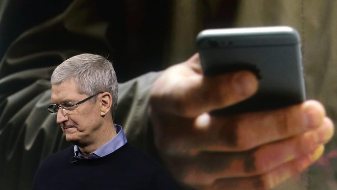 Apple CEO Tim Cook speaks at a March product unveiling at company headquarters in Cupertino, Calif. Apple and other tech companies are pushing back against the surveillance state in the nation’s courts.