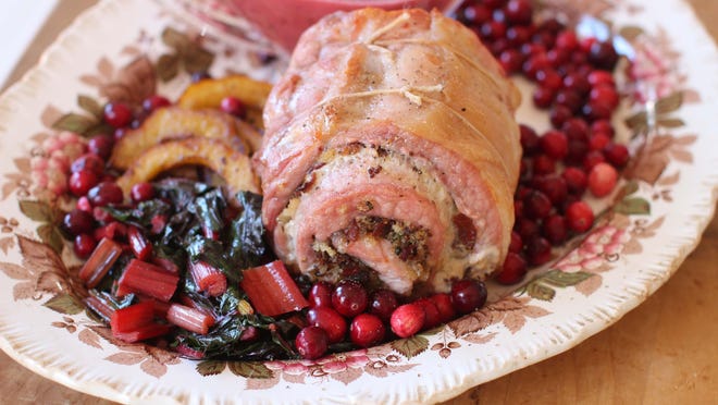 Stuffed pork loin with cranberry beurre blanc.