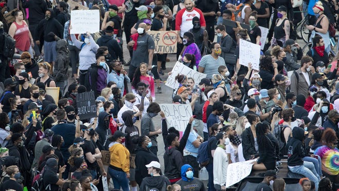 Demonstrators fill the intersection of Broad and High during a protest in downtown Columbus on Sunday, May 31, 2020.