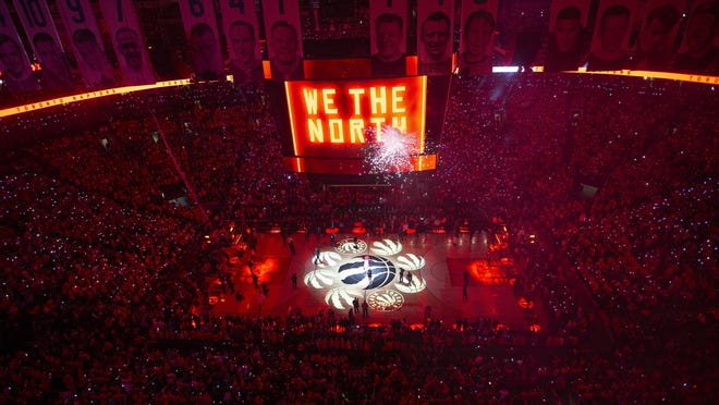 FILE - In this June 2, 2019, file photo, the court is illuminated at Scotiabank Arena ahead of the first half of Game 2 of the NBA Finals between the Toronto Raptors and the Golden State Warriors in Toronto. The Canadian government has denied a request by the NBA and the Raptors to play in Toronto amid the pandemic. An official familiar with the federal governmentâ€™s decision told The Associated Press on Friday, Nov. 20, 2020, there is too much COVID-19 circulating in the United States to allow for cross-border travel that is not essential.