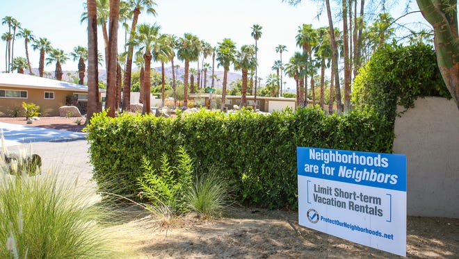 A resident’s front yard sign advocates for limiting short-term vacation rentals in the Deepwell neighborhood in Palm Springs, August 29, 2016. 