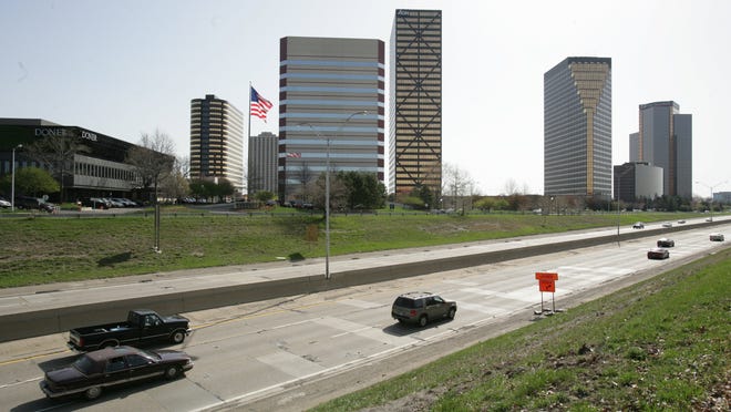 Traffic moves along the Lodge Freeway near the Southfield Town Center, a prized jewel of Southfield office space.