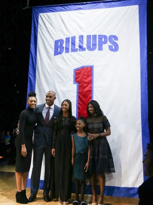 Pistons legend Chauncey Billups and his family watch as his number is retired during halftime Wednesday at the Palace.