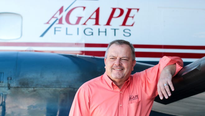 Allen Speer, CEO of Agape, an aviation ministry, stands with his plane, which delivered water purification systems and food packets to Cuba on Aug. 23. Water One in Fort Myers made the water purifiers.
