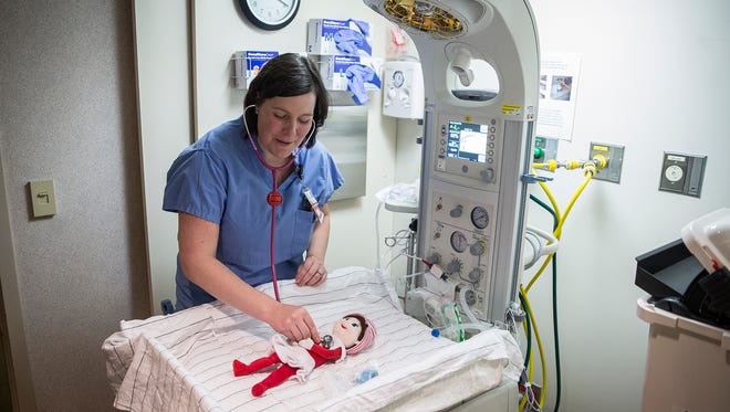 Flo the Elf receives a newborn checkup at IU Health Ball Memorial Hospital. 