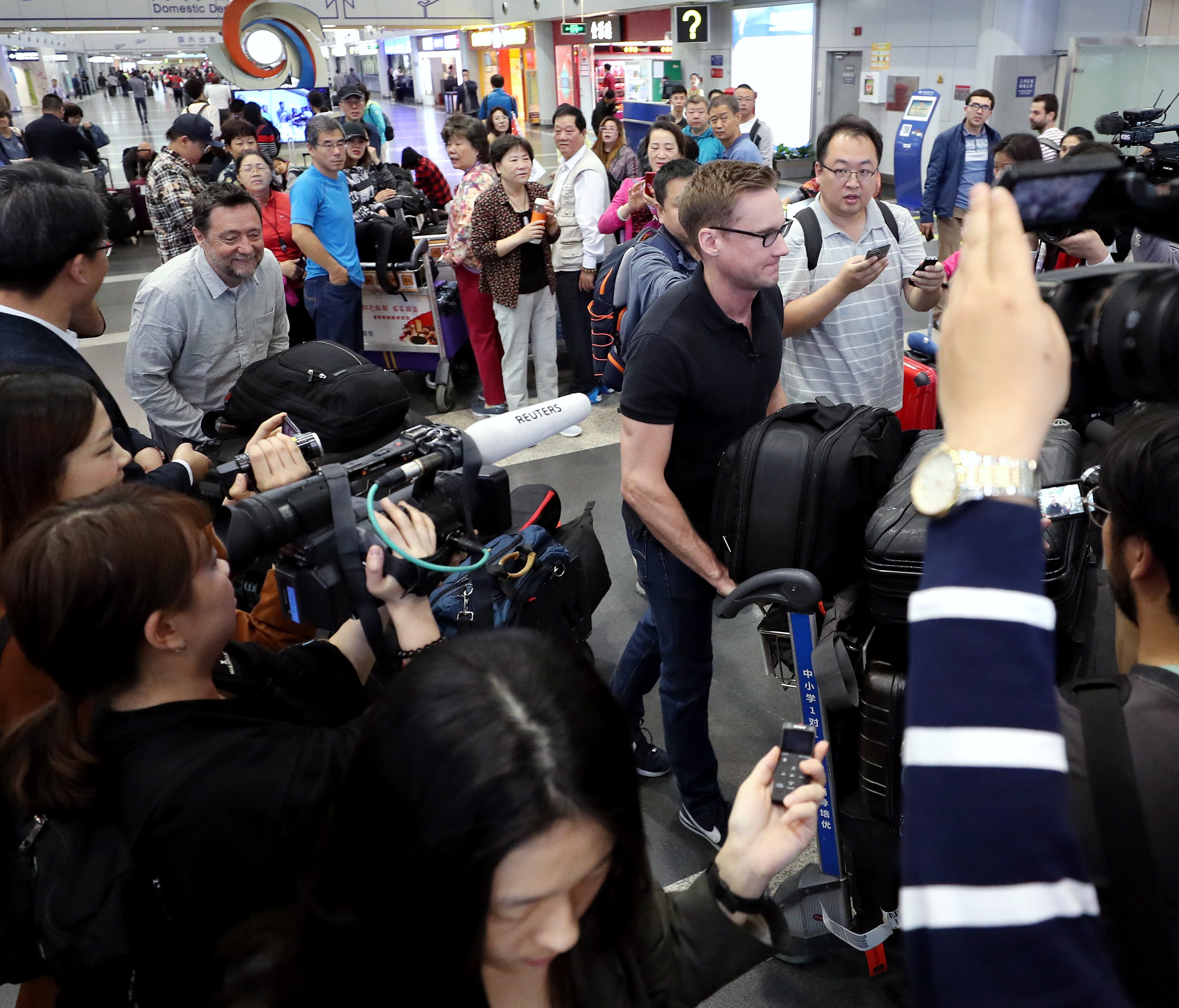 Foreign correspondents invited by North Korea to cover its nuclear site dismantling event depart from a Beijing airport, China, on May 22, 2018.