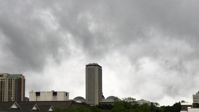 Dark storm clouds hang low over the Tallahassee skyline.